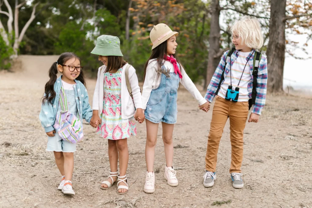 group of children holding each others hands