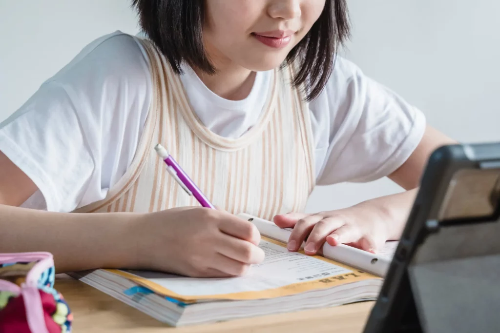 a girl attending online schooling
