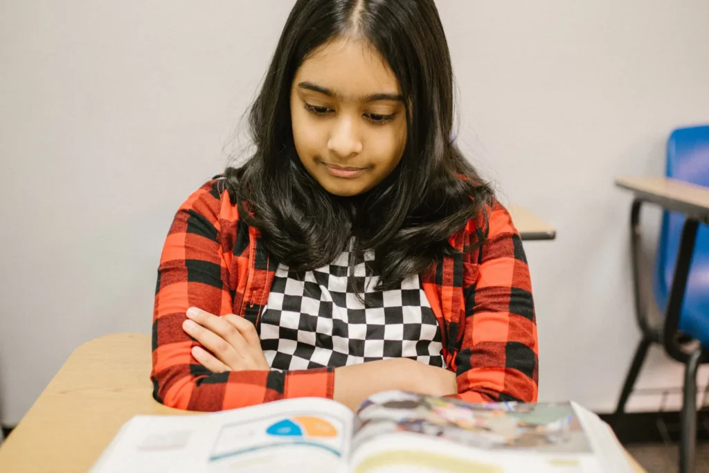 student reading an open book