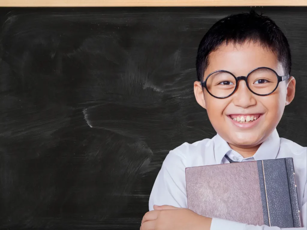 a person wearing glasses and a tie holding a book