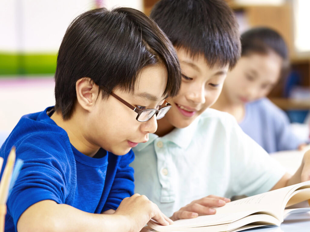 Two primary school student studying together | Tuition Centre SG