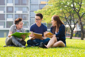 group of students sharing in the campus lawn | Tuition Centre