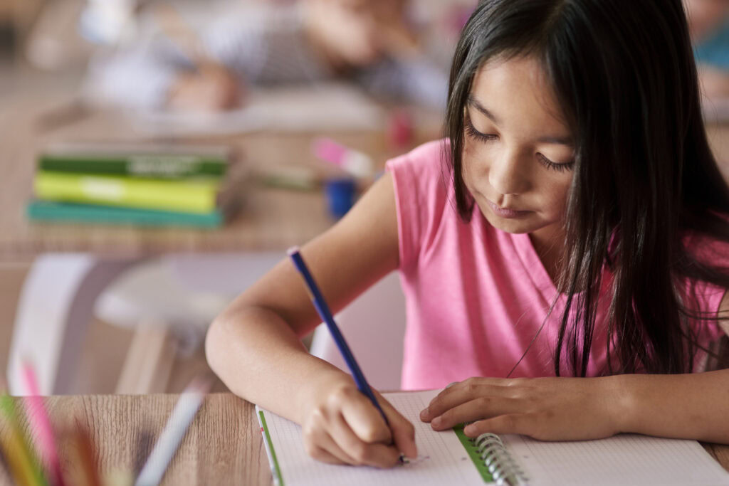 Student sitting at desk during lesson | Tuition Centre SG