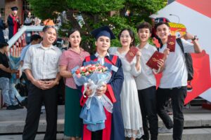 Happy Family Posing with Son After Graduation | Tuition Centre SG