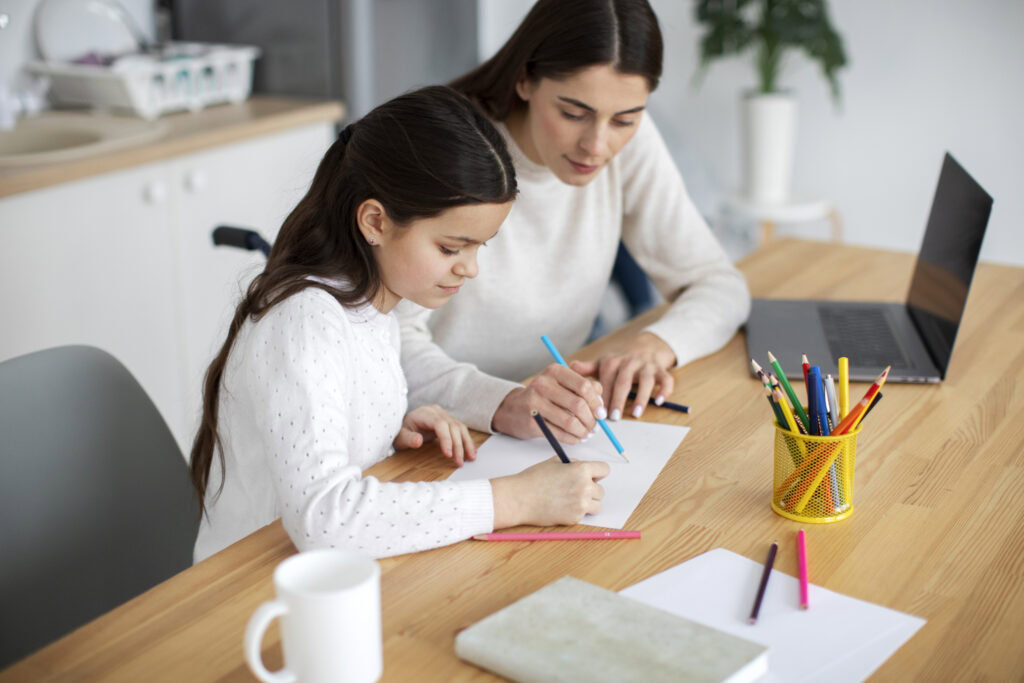 A tutor helps the ADHD student with their study. | TCS