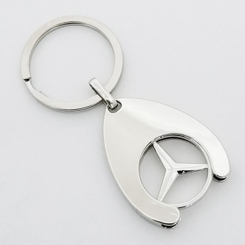 Silver metal detachable shopping cart token keychain with a Benz symbol.