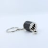 A silver and black metal fidget gear shift keychain with clear gear markings, attached to a standard key ring, on a white background.