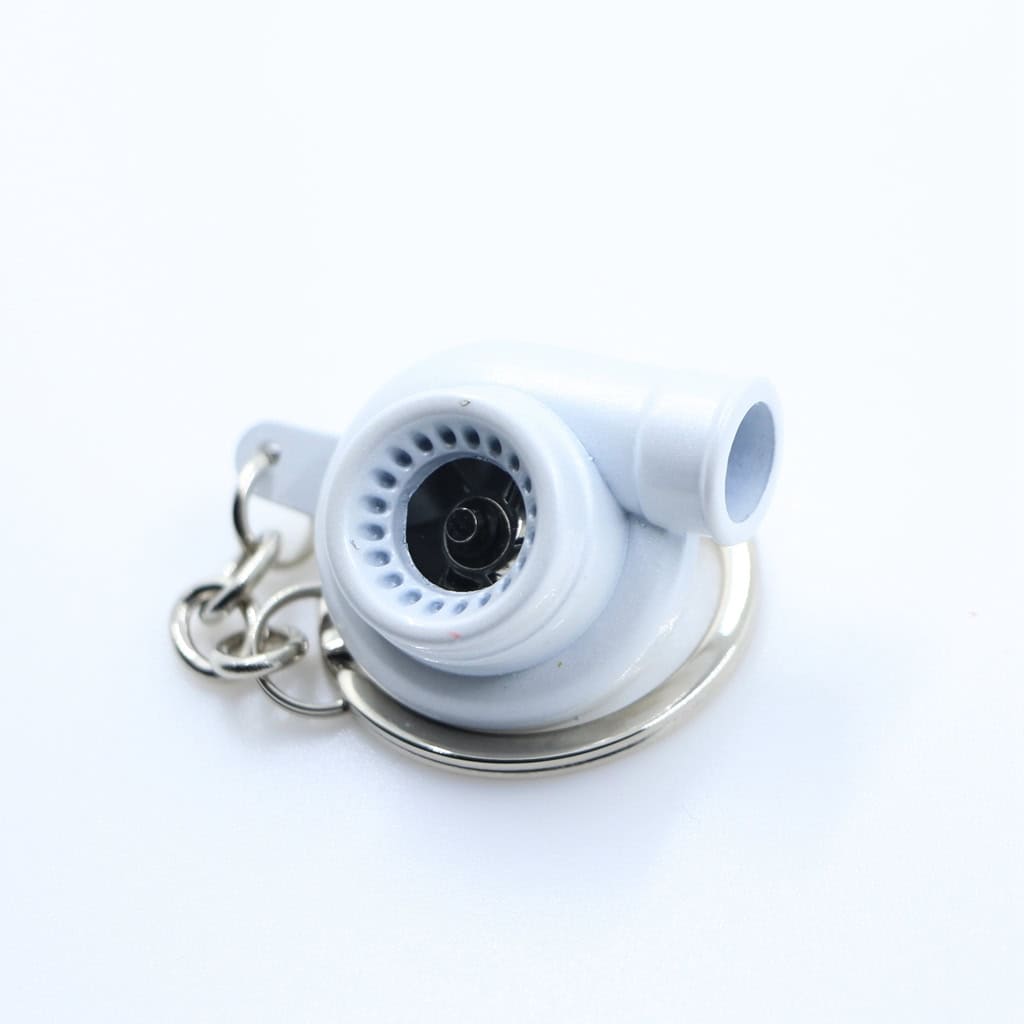 Detailed white car engine keychain with metal chain. Perfect for car enthusiasts and promotional branding.