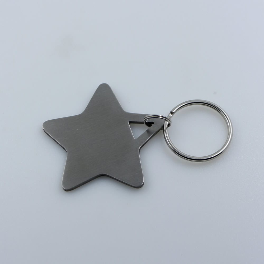 Star-shaped metal keychain with a silver ring, perfect for personalized branding or promotional gifts.