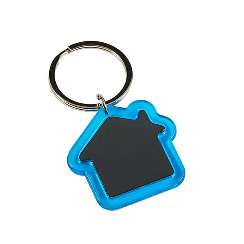 A silver metal keychain with a house-shaped pendant featuring a blue leather strap, attached to a silver key ring.