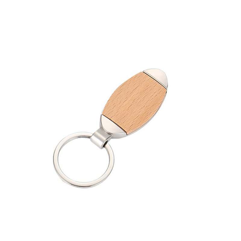 A custom wood and metal keychain with an oval wood piece, a silver metal frame, and a key ring.