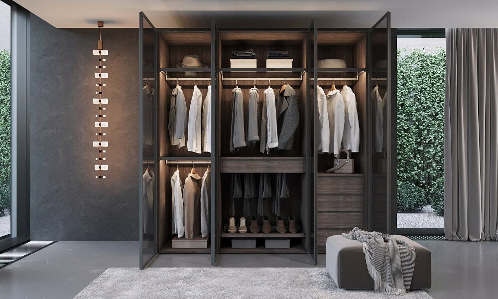 Spacious walk-in closet featuring neatly arranged clothing and accessories in a contemporary setting.