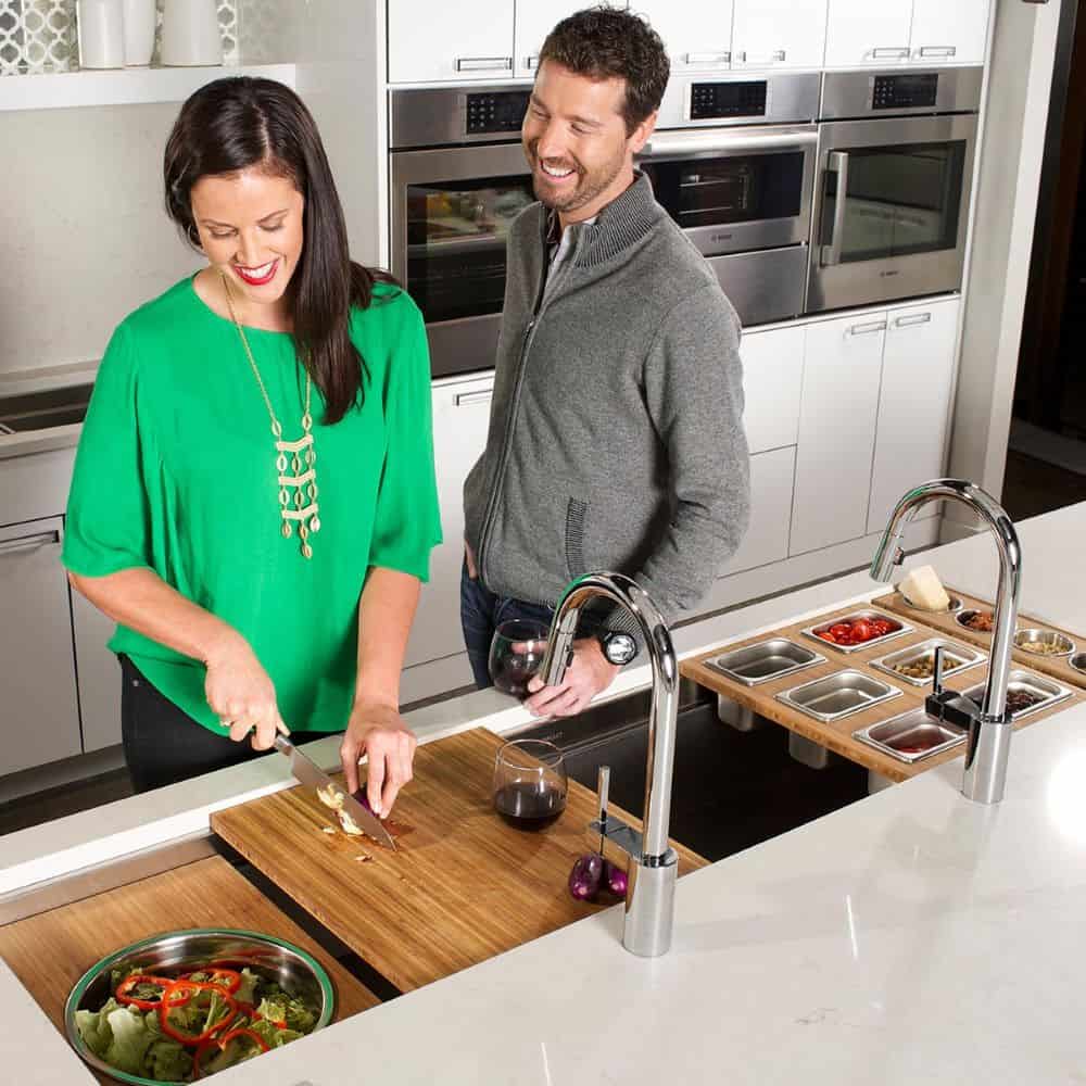 Couple preparing a healthy meal in a contemporary urban kitchen with modern appliances and sleek des.