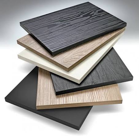Laminate vs. melamine kitchen cabinet door samples in wood-grain and solid-color finishes