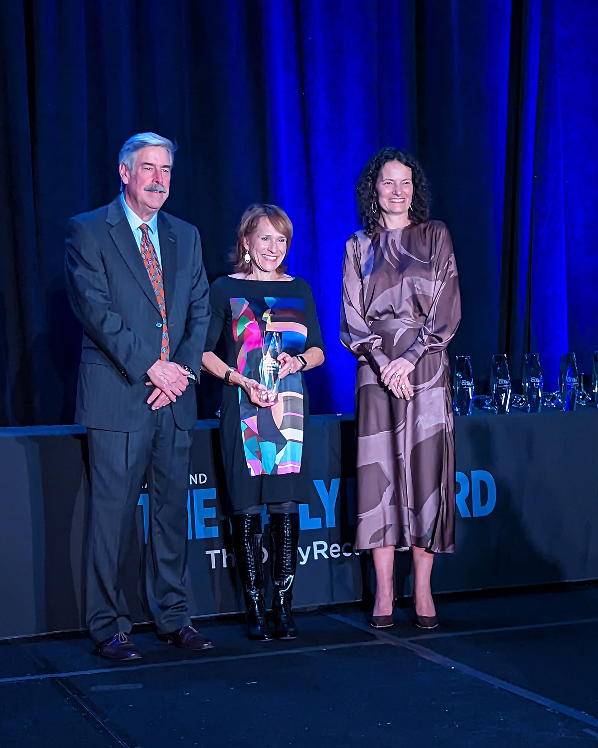 Elise Elfman accepting award at Most Admired CEOs event