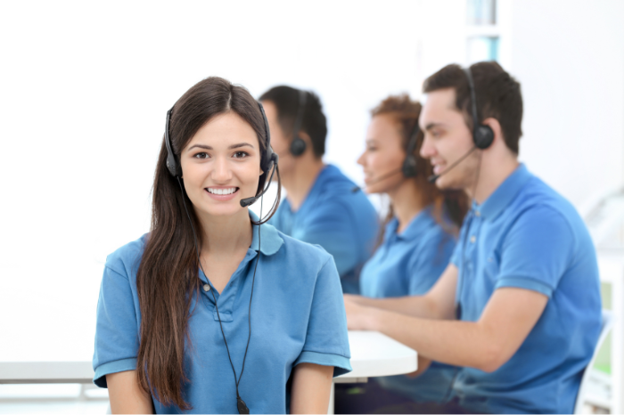 Customer service team wearing blue polo uniform shirts