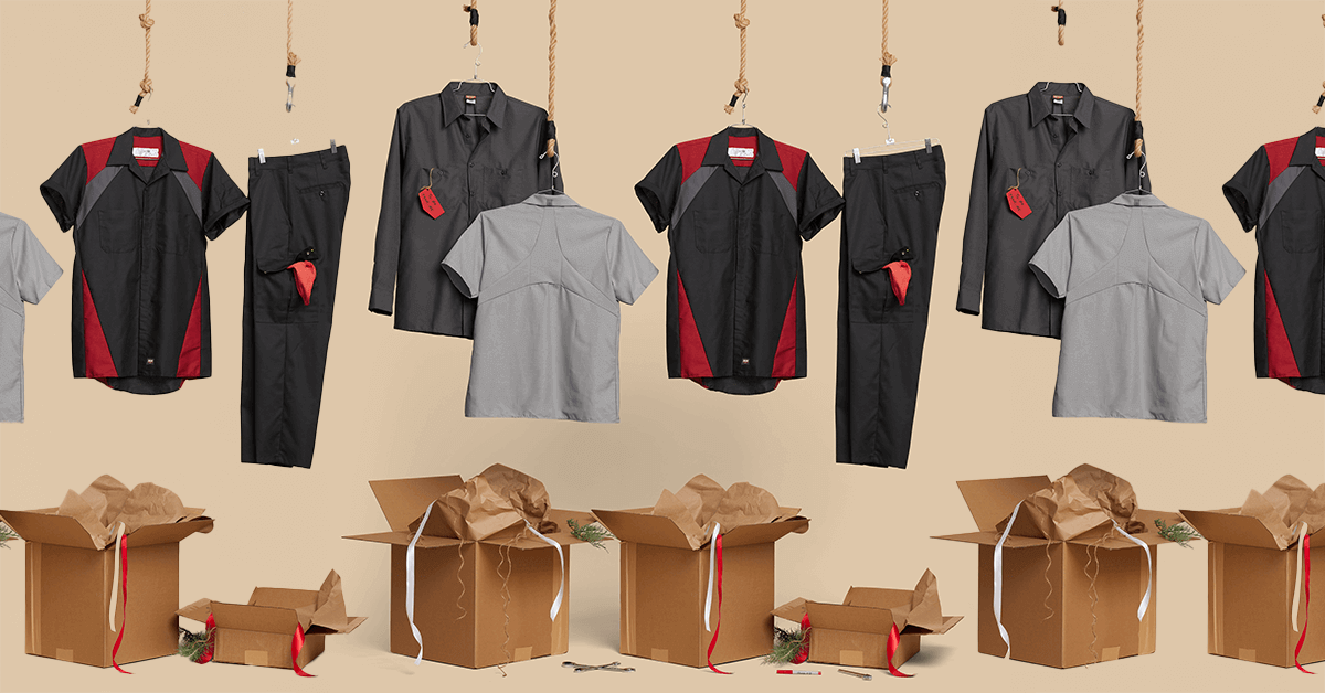 Industrial work uniforms (red, black, and gray shirts) hanging above unsorted cardboard distribution boxes, symbolizing the logistical challenges, hidden administrative labor, and costly overstocking associated with manual uniform inventory management.