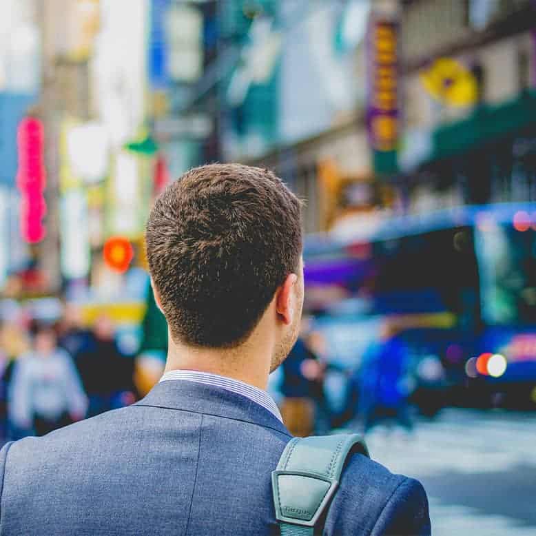 Independent agent looking at busy city street