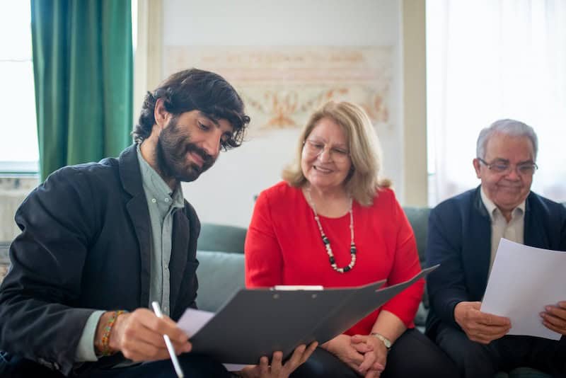 An agent helping a couple customize their insurance