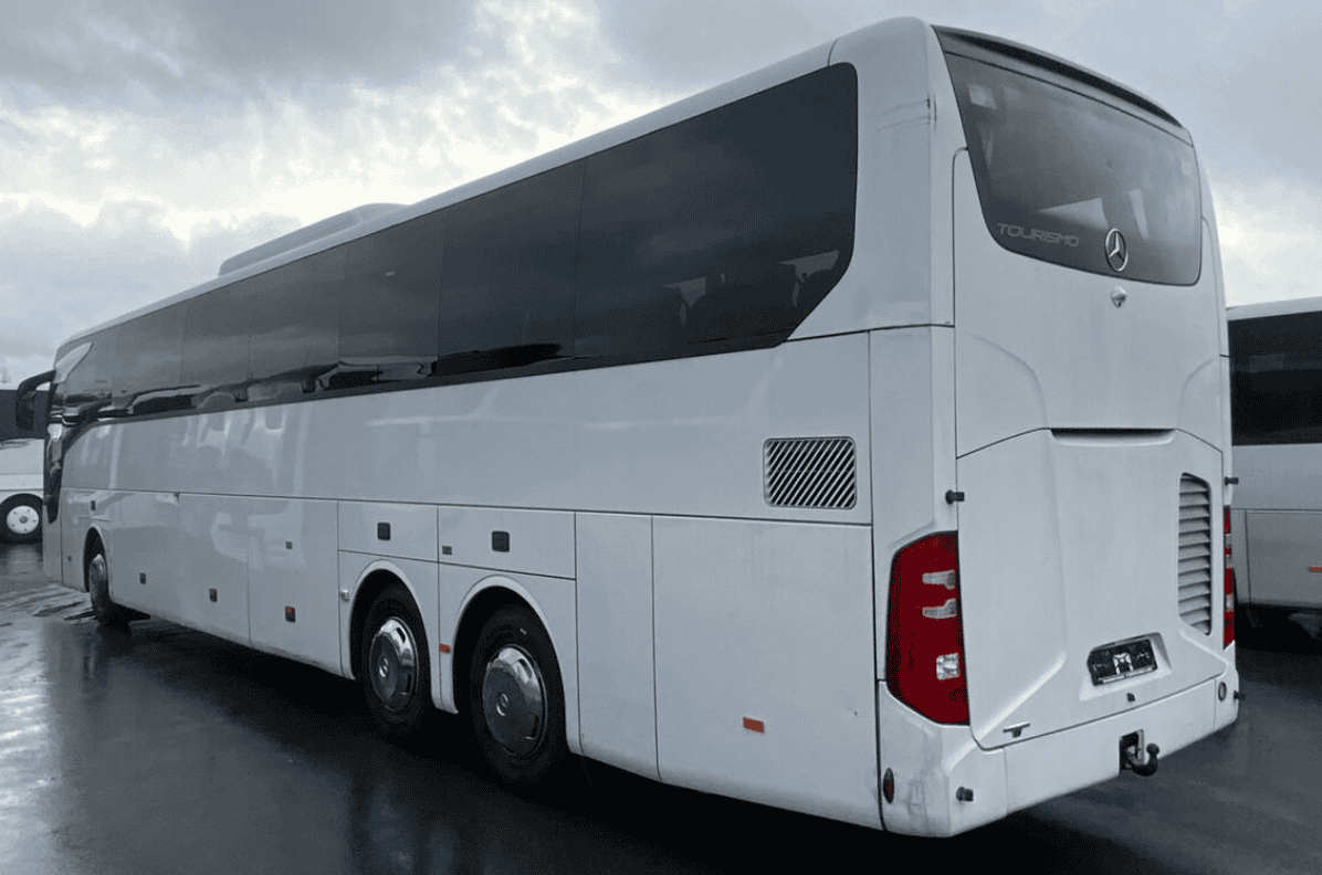White Mercedes-Benz Tourismo coach, rear three-quarter view
