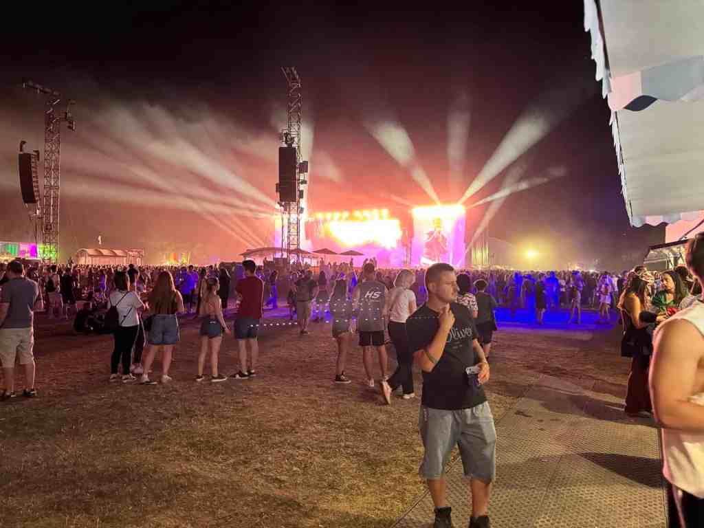 Festival crowd facing a brightly lit Sziget stage at night in Budapest in 2025