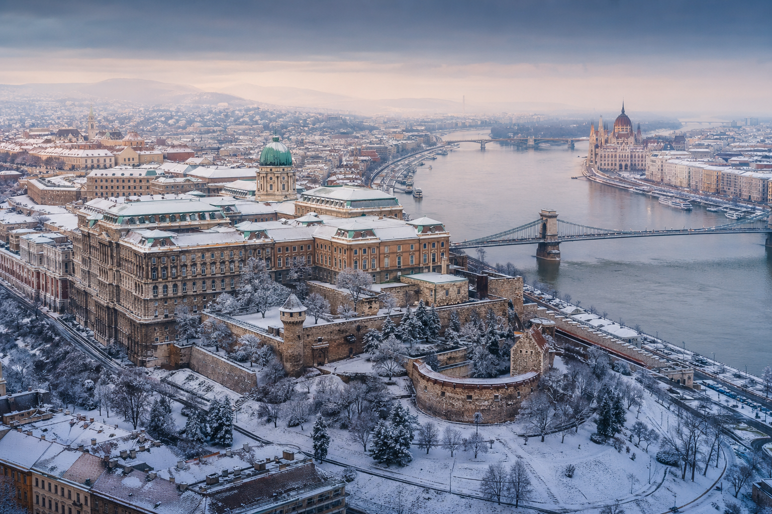 Snow-covered Buda Castle overlooking the Danube River in Budapest, Hungary.