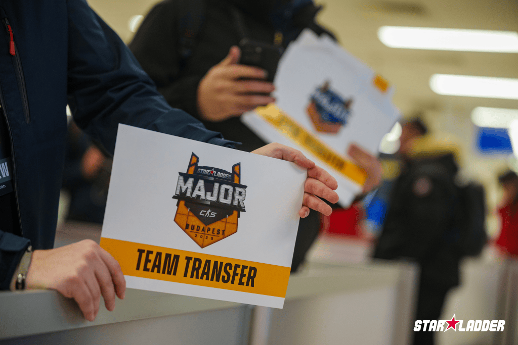 StarLadder Budapest Major team-transfer welcome sign held in an arrivals area