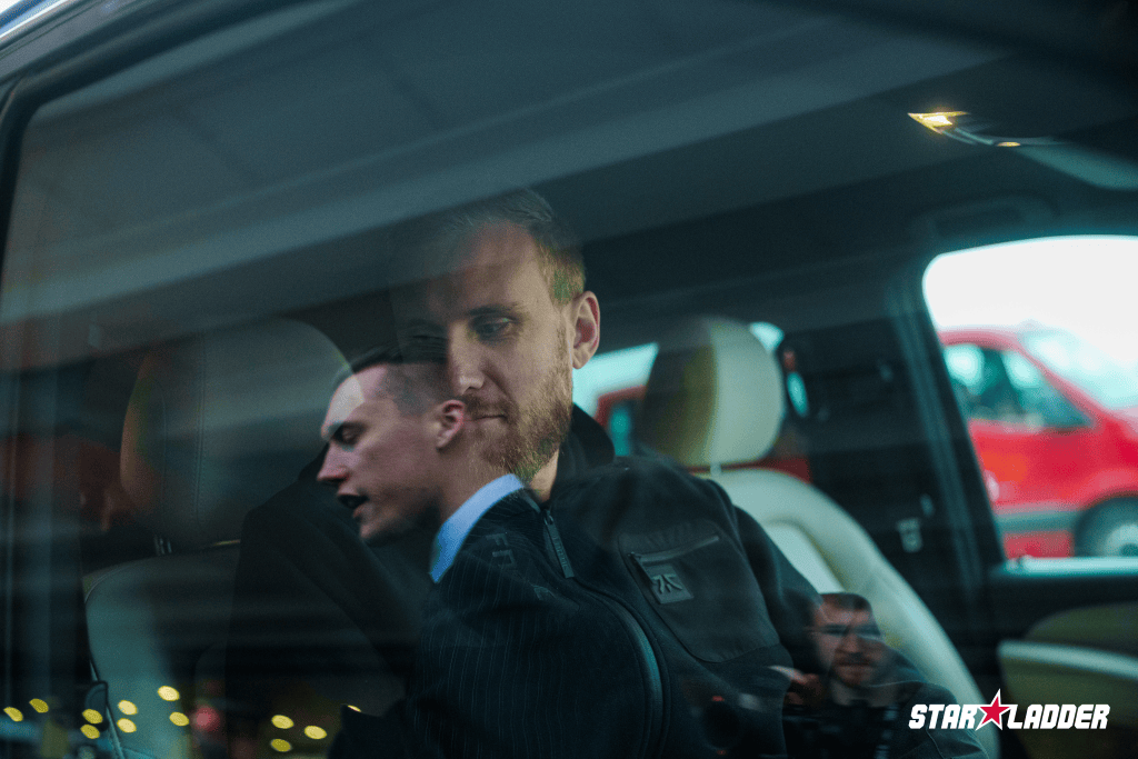 Passengers seen through the window of a transfer vehicle in the StarLadder Major archive.