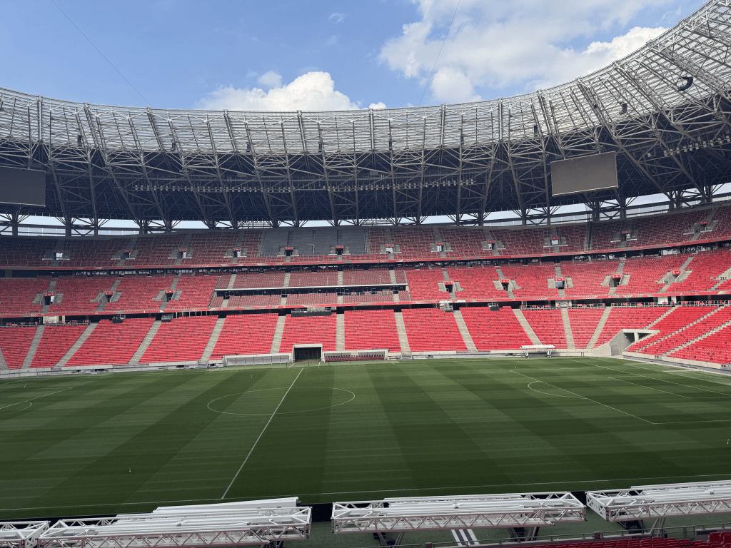 An open view across the Puskás Aréna playing surface and stands.