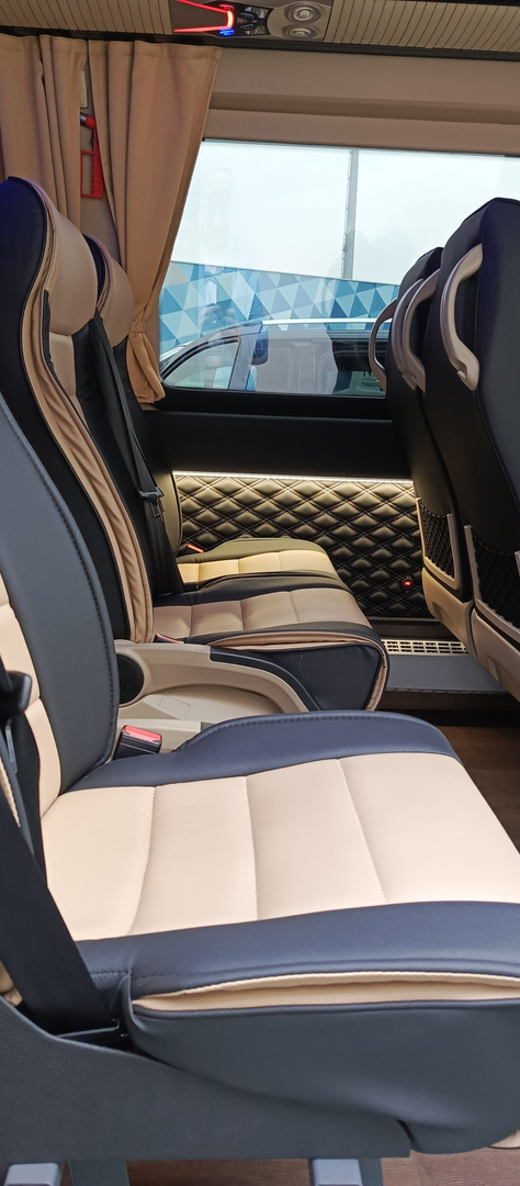 Cream leather seating beside a curtained window