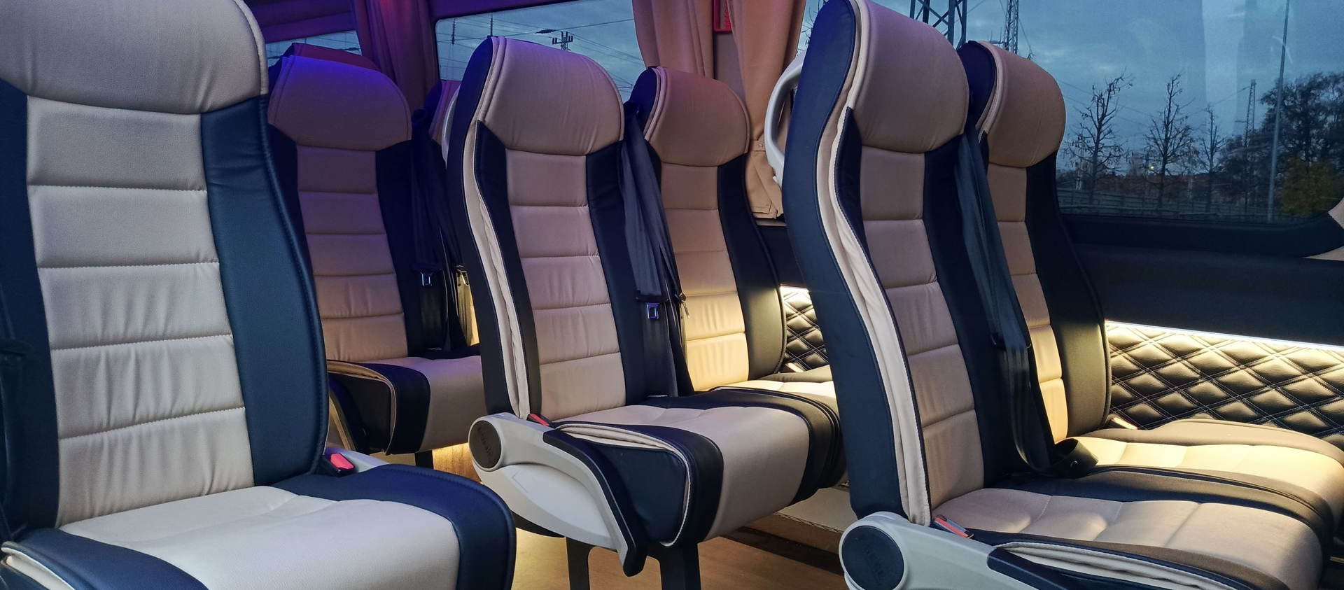 Rows of sport-style seats with diamond stitching