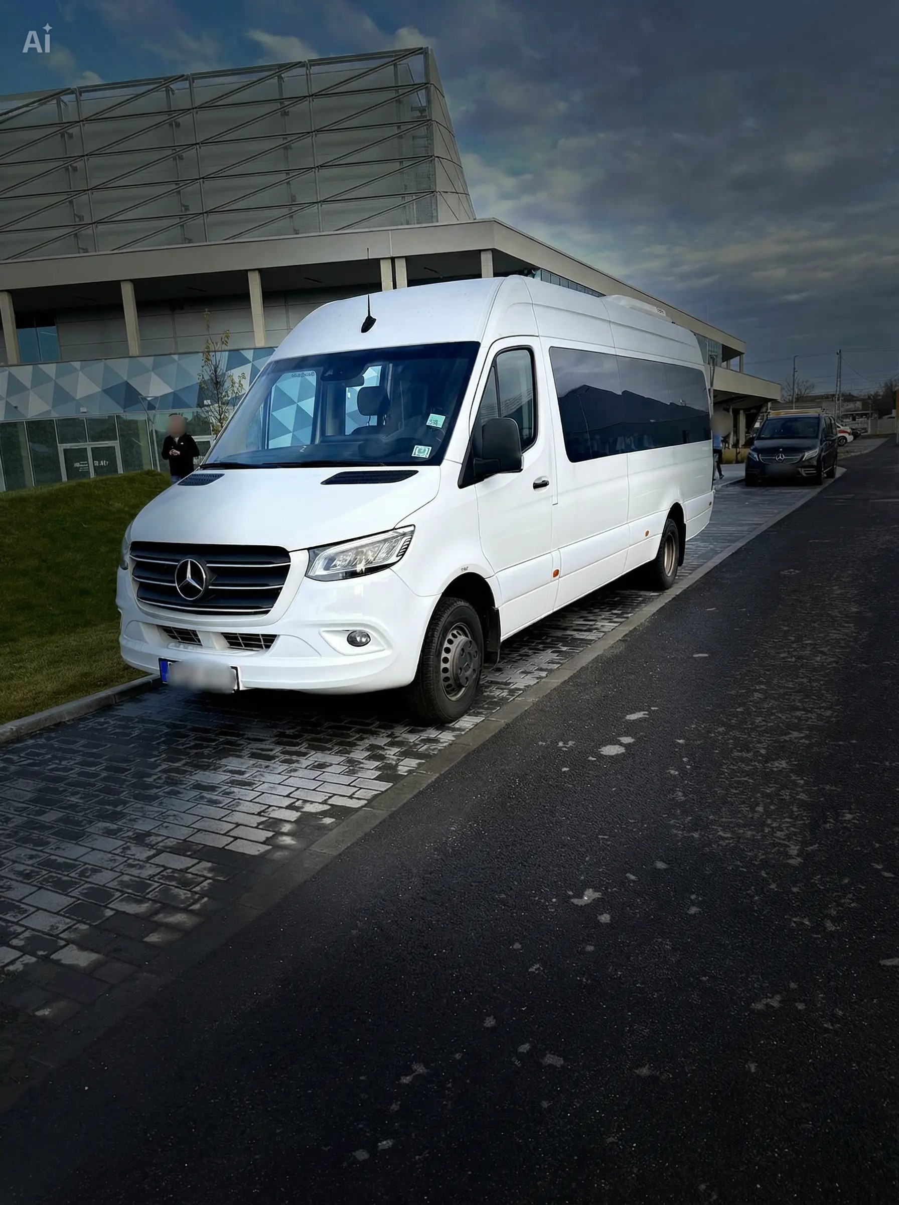 The white Sprinter minibus on the move