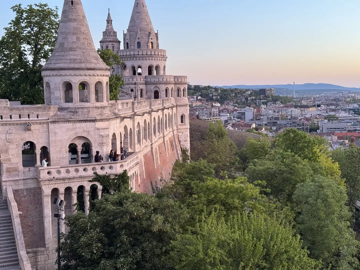 Budapest Castle Hill with Fisherman's Bastion and city view at sunset.