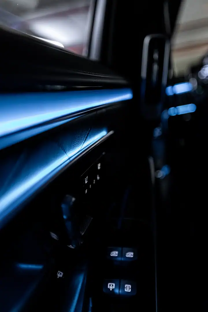 Close-up of the Mercedes-Benz S-Class door panel with ambient lighting