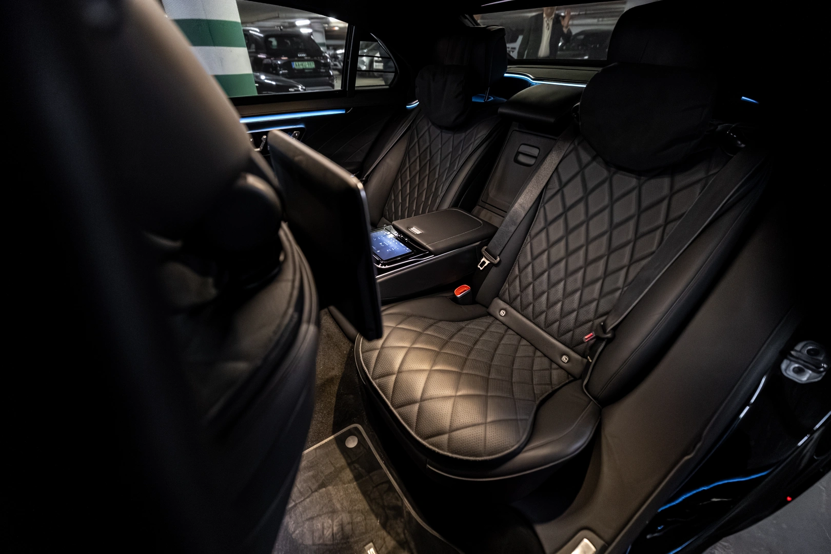 Mercedes-Benz S-Class rear cabin with quilted leather seats and ambient lighting