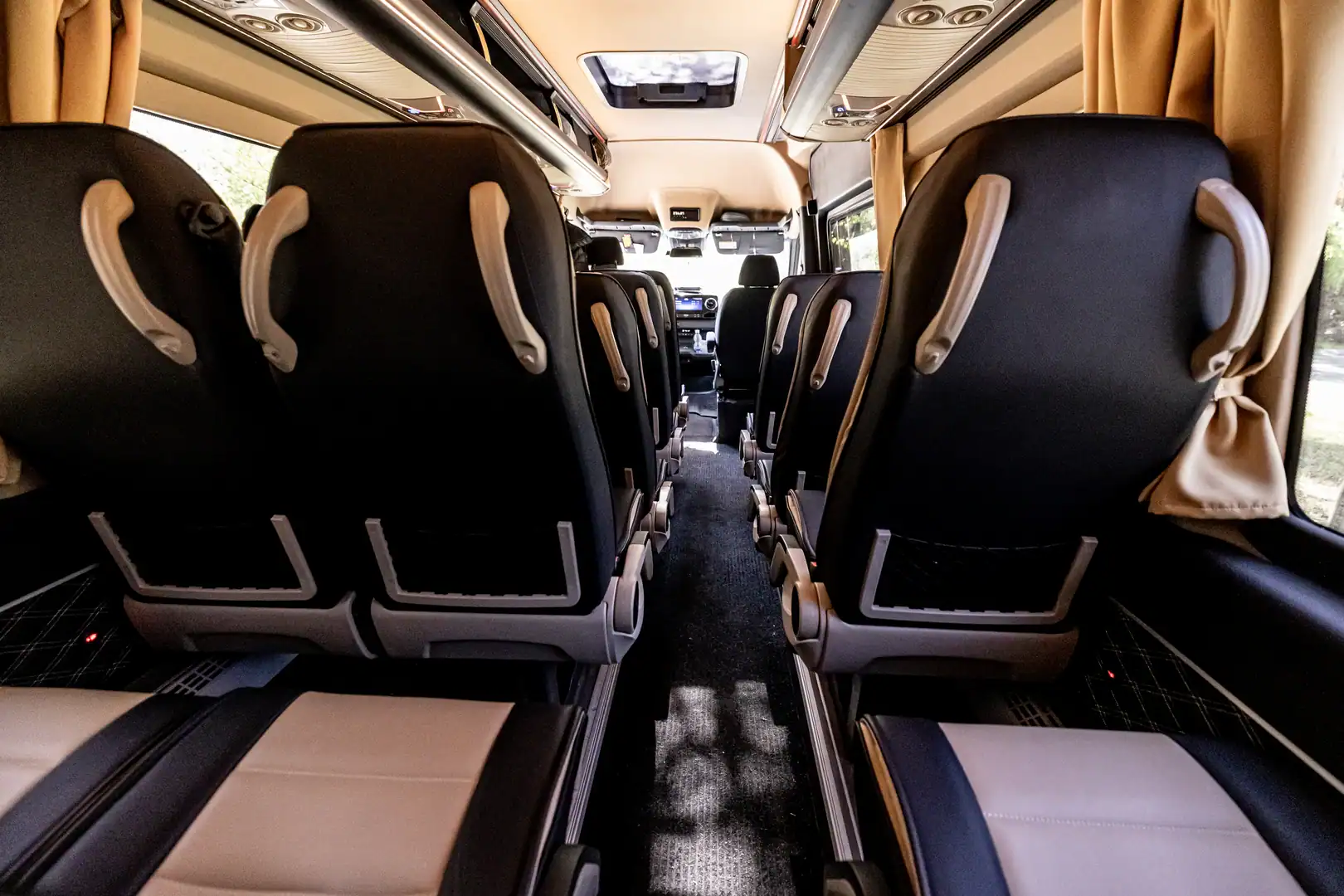 Black sport-style seats framed by side curtains