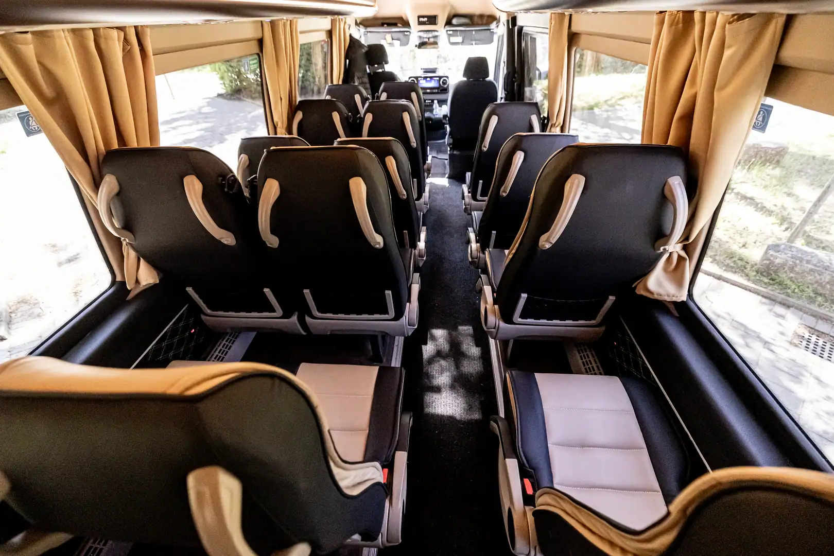 Interior of a minibus with rows of seats