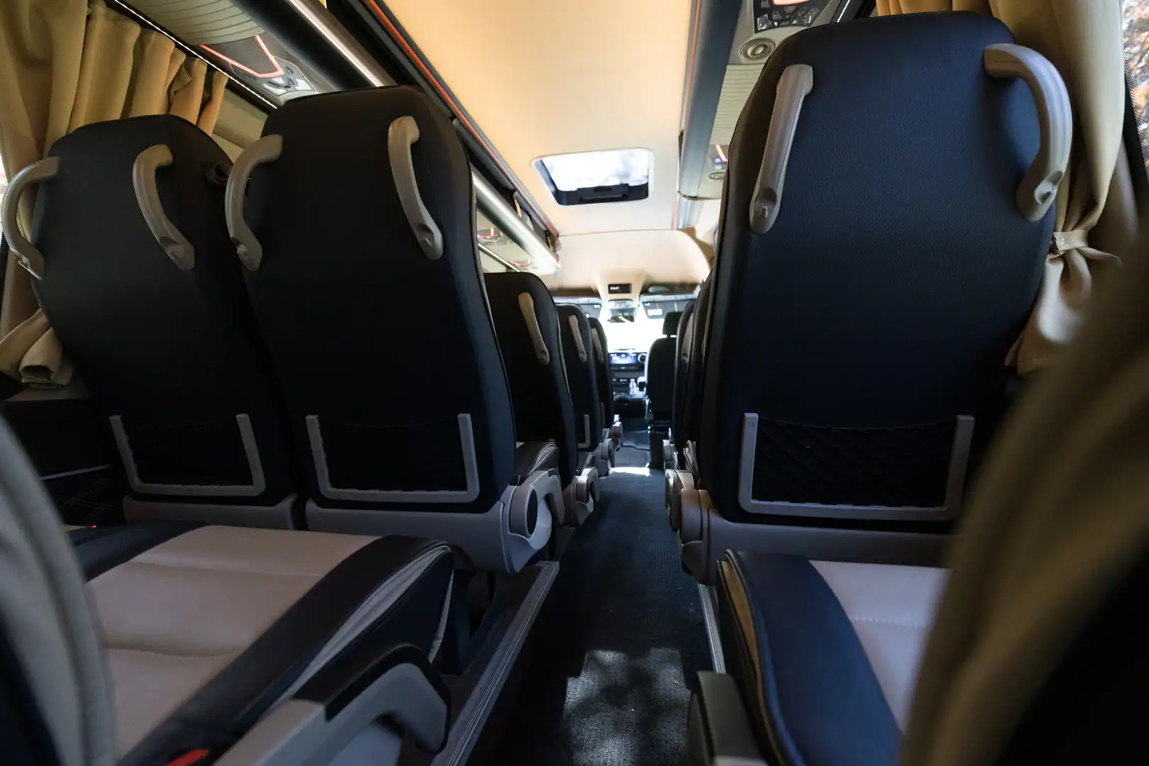 Supportive black headrests along the length of the cabin