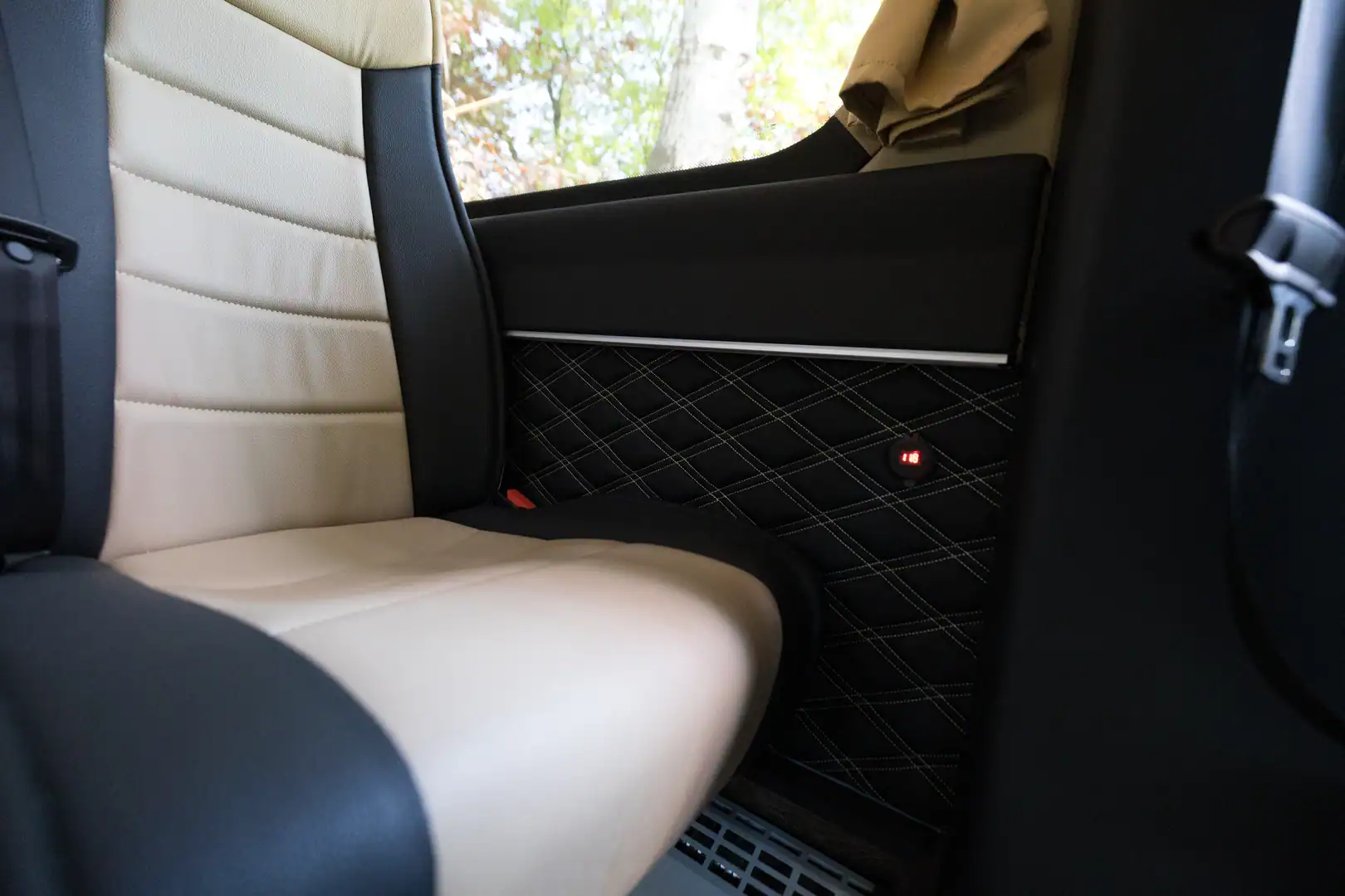 Rear bench seat in quilted cream and black leather