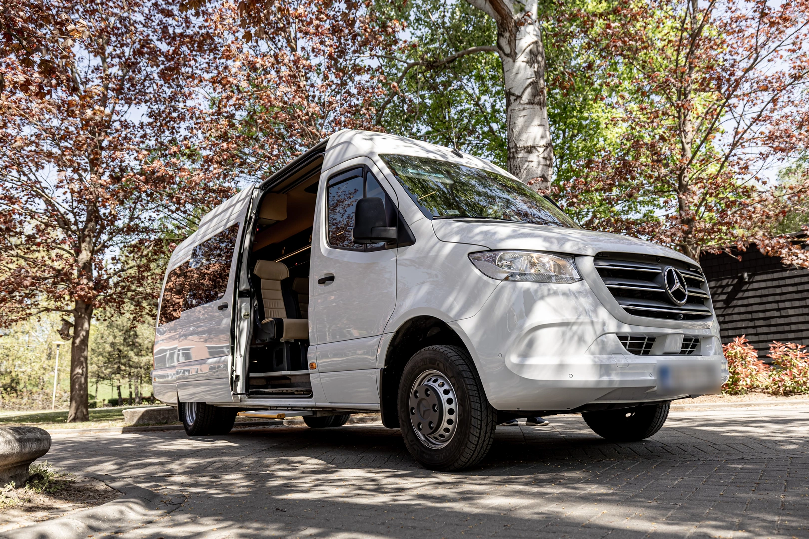 Front of a white Mercedes-Benz Sprinter minibus