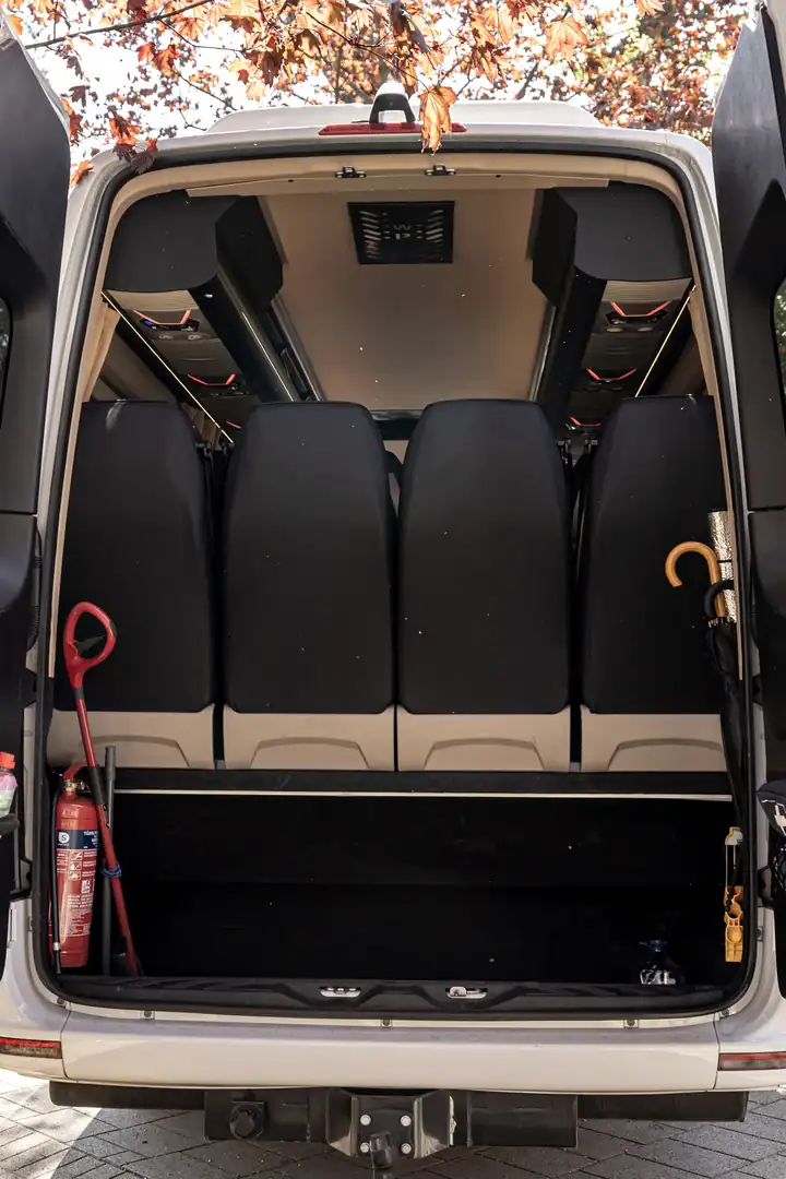 Rear doors open, showing the luggage area