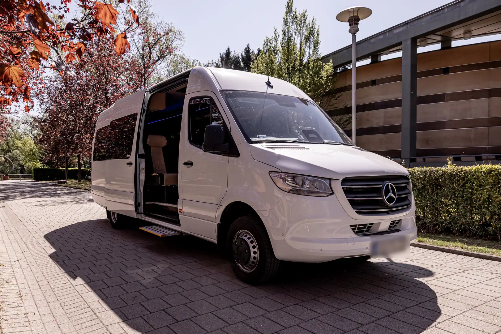 White Mercedes-Benz Sprinter minibus