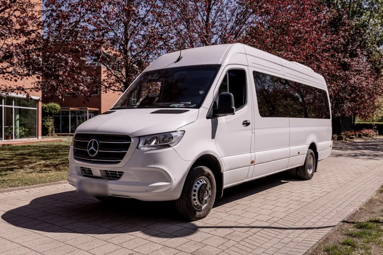 White Mercedes Sprinter minibus, front three-quarter view