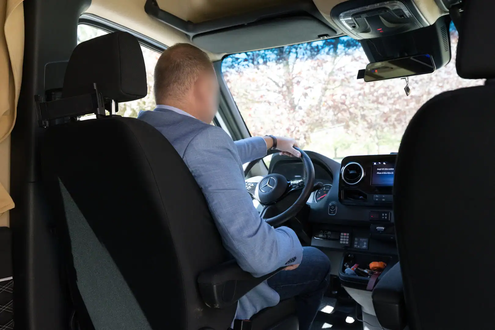 A professional chauffeur at the wheel