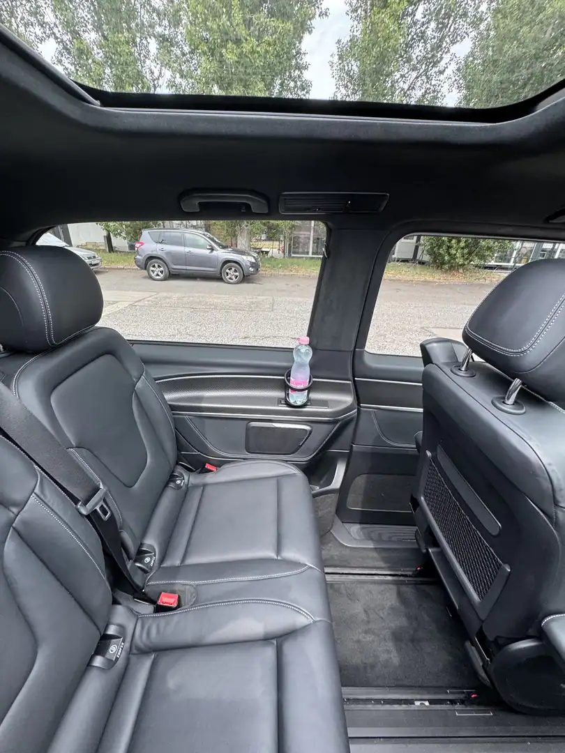 Rear leather passenger seats and legroom inside a Mercedes V-Class