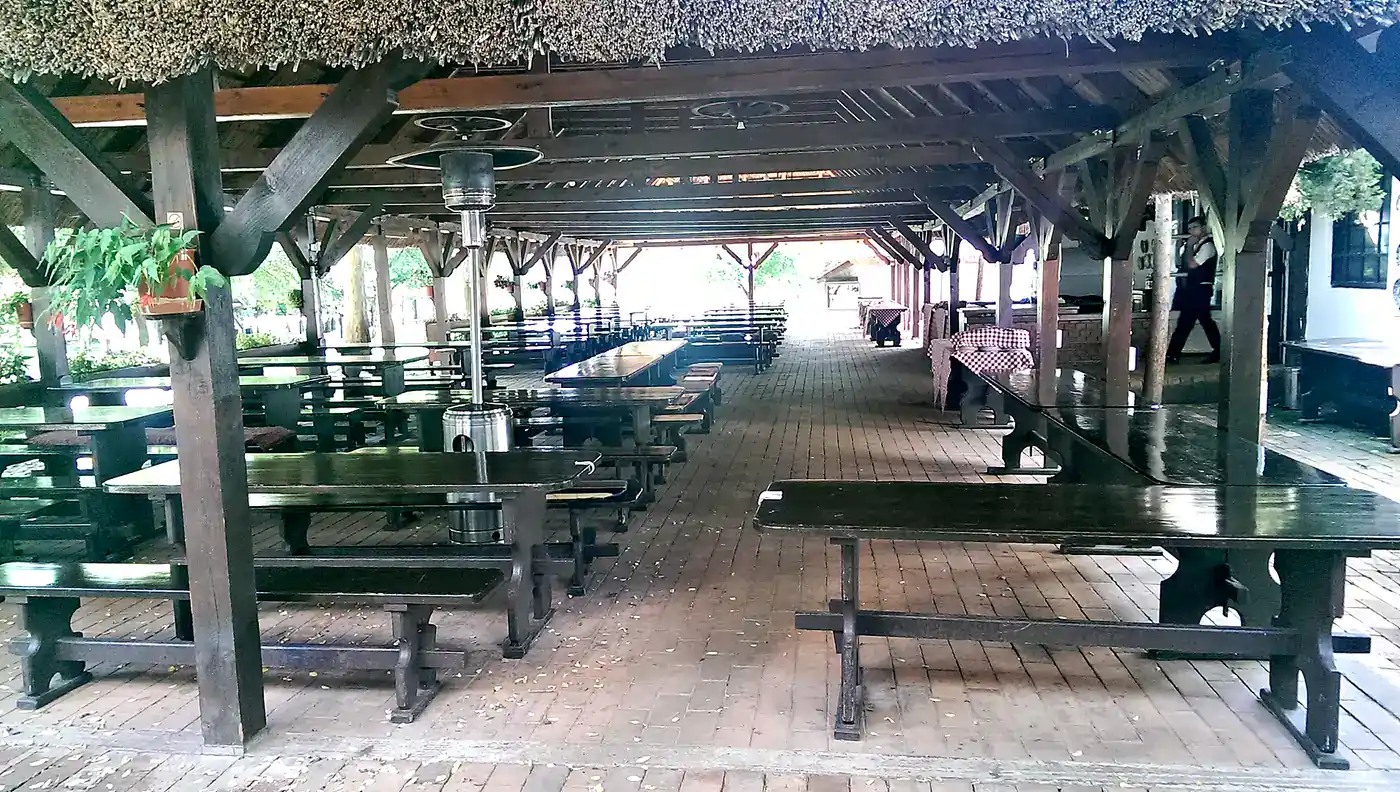 Covered wooden dining terrace at a traditional Hungarian csárda