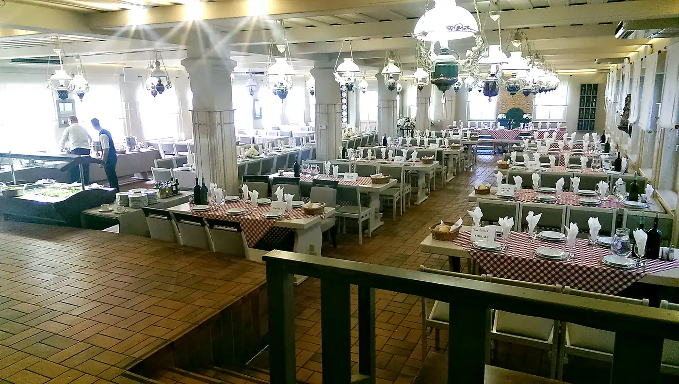 Large traditional Hungarian dining hall set for a group lunch