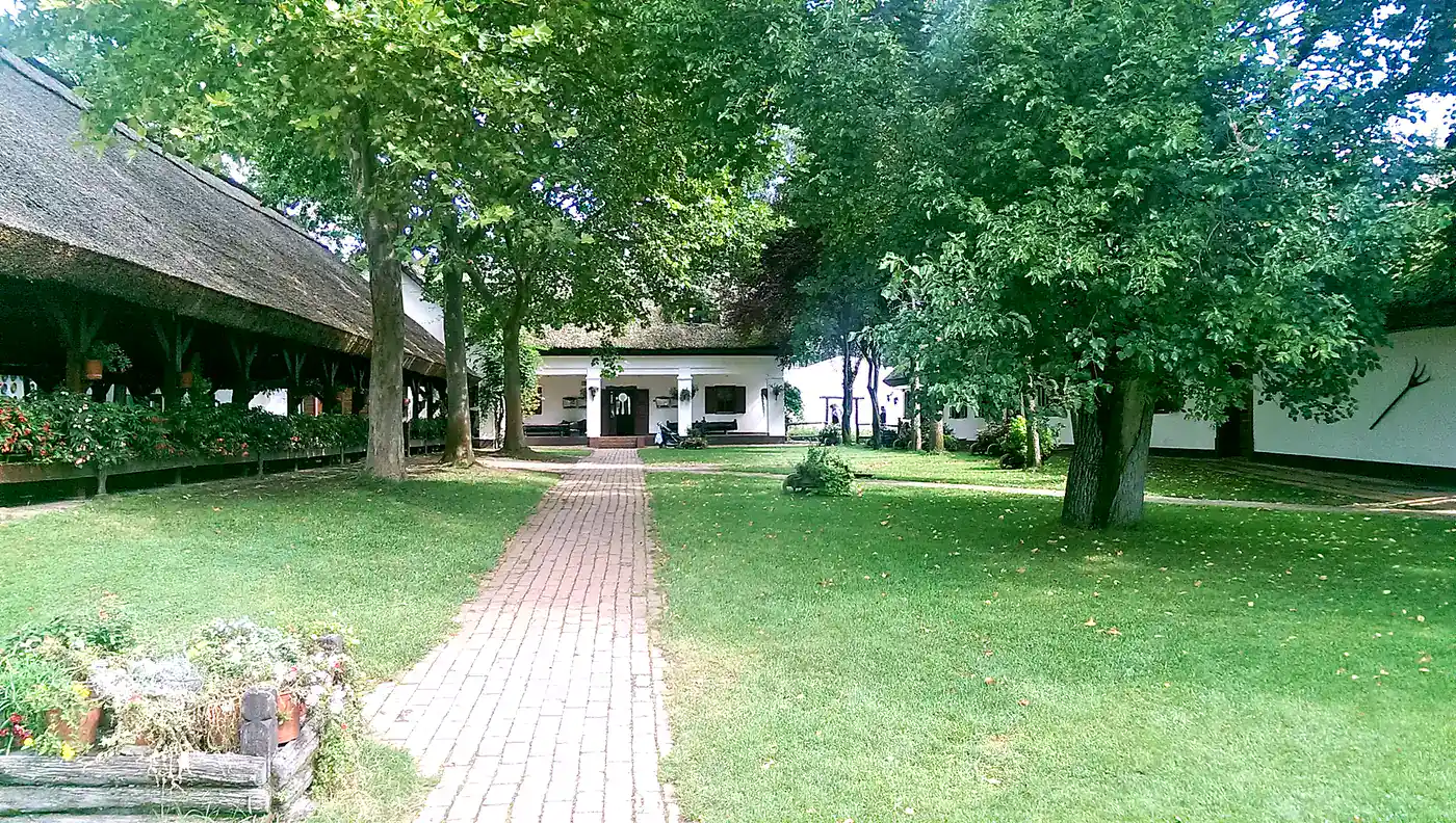 Brick walkway through the courtyard of a traditional Puszta farm