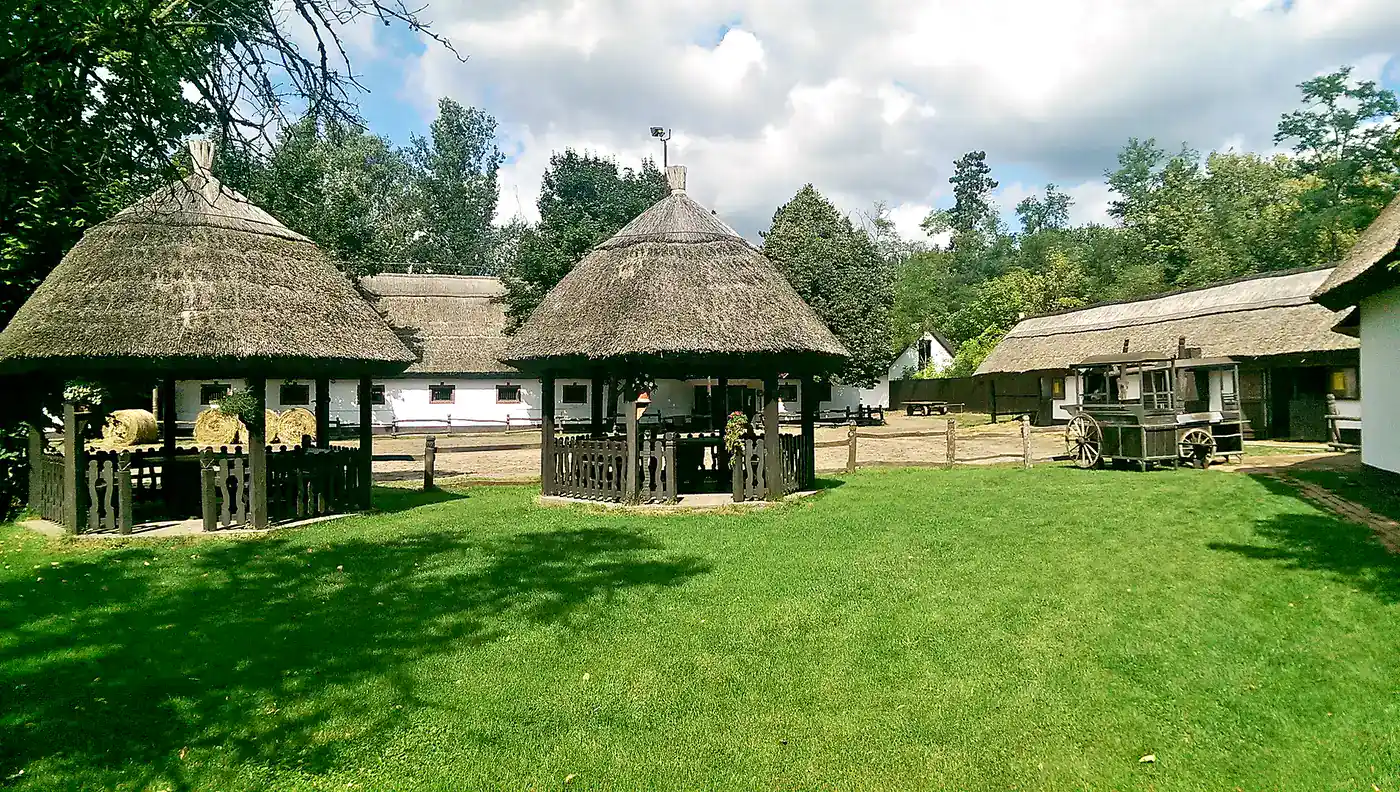 Traditional thatched pavilions at a Hungarian Puszta farmstead