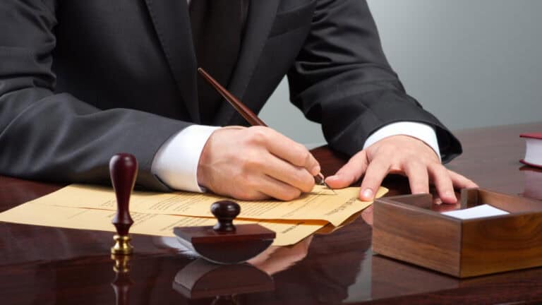 Legal professional reviewing documents related to securities law and investment fraud cases.